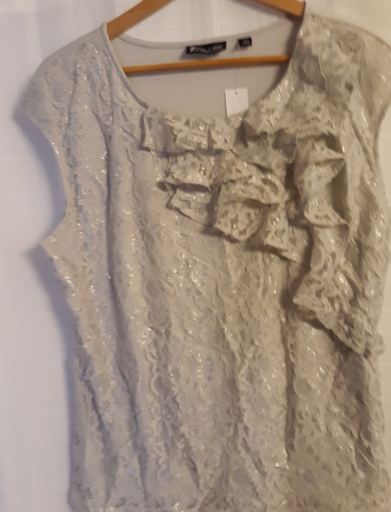 New with tags on, sleeveless silver top